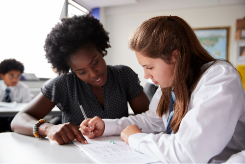 Teacher working with a student