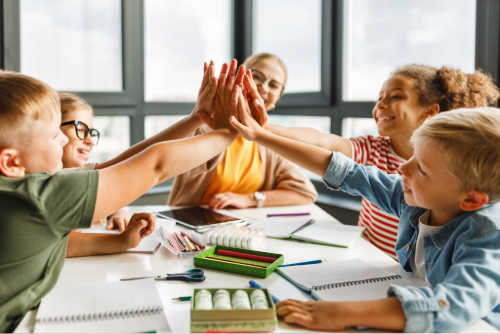 Group of students working with their teacher